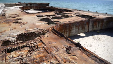 Old rusty structure by the sea. Slow motion Video stock 117509417