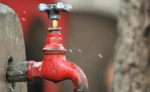 Old rusty tap leaking water Stock Photos
