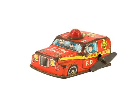 Old, rusty tin toy. Firefighter car. Stock Photos
