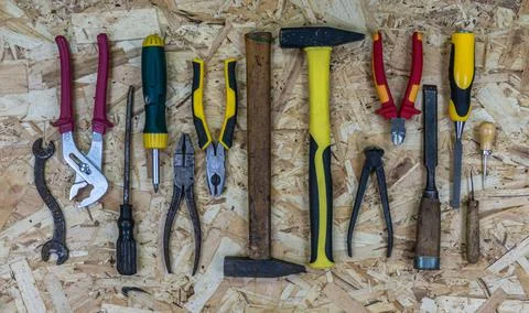 Old rusty tools vs modern tools. Concept: equipment upgrade. Stock Photos