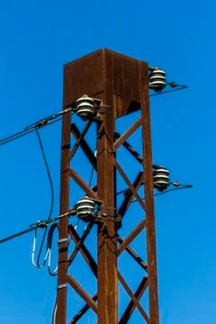 Old rusty top of an electrical tower Stock Photos