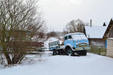 Old rusty track in winter day in village of Belarus Stock Photos