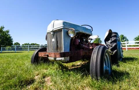 Old Rusty Tractor in a Field Stock Photos