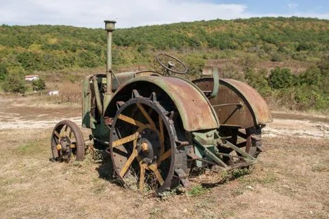 Old rusty tractor in a field Stock Photos