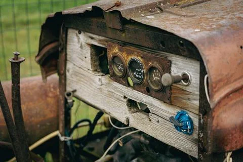 Old rusty tractor or car with handmade cheap instrument cluster Stock Photos