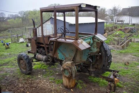 Old rusty tractor without wheels Stock Photos