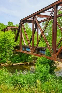Old rusty train bride over Kokosing River in summer vertical Stock-Fotos