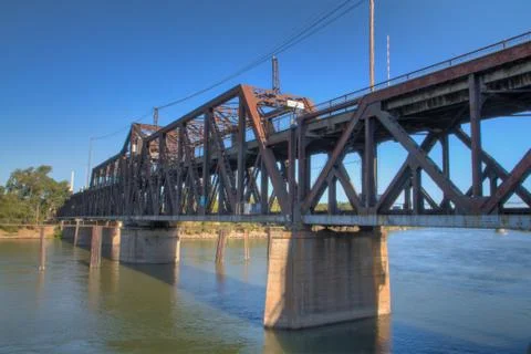Old rusty train bridge far Stock Photos
