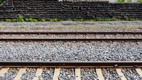 Old Rusty Train Tracks with Stacked Concrete Sleepers Stock Photos