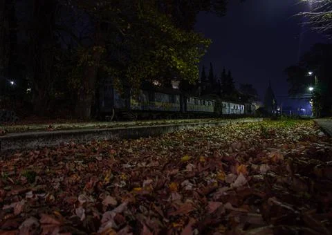 Old rusty train wagons at night Stockfoto's