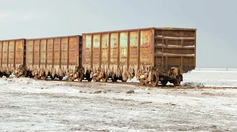 Old rusty train wagons with stalactites of salt Stock Footage 57722099