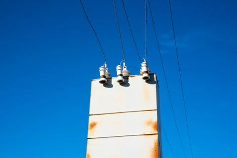 Old rusty transformer shield against the sky Stock Photos