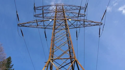 Old Rusty Transmission Tower and High Voltage Power Lines on Blue Sky Background Stock Footage 107423452