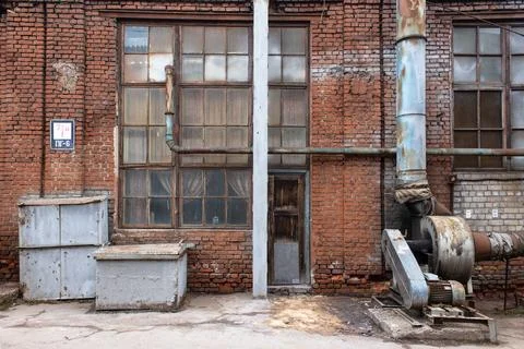 An old rusty ventilation system in an outdated metal recycling plant. Collaps Stock Photos