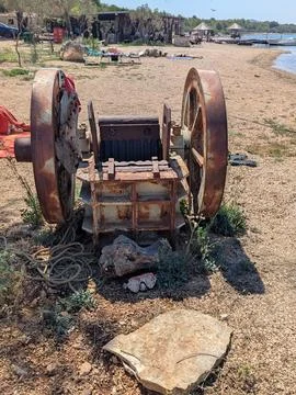 Old rusty vintage machine on a sunny beach in Croatia Stock Photos