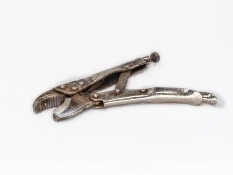 Old rusty Vise Grip Locking Pliers shot on white. Stock Photos