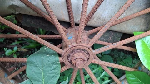 An old rusty wagon wheel	 Stock Footage 326296740