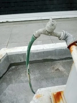 Old Rusty Water Tap Between Concrete Walls Stock Photos