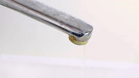 Old rusty water tap is open, stream of water flows down. Stock Footage 188047169