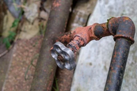Old rusty water tap. Stock Photos