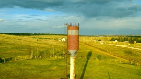 Old rusty water tower in village Stock Footage 129441179