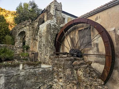 Old Rusty Water Wheel of a Historic Country Mill in Liguria Stock Photos