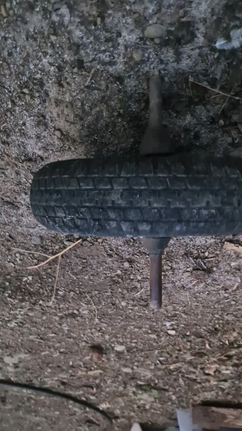 Old Rusty Wheel on Ground Stock Footage 318093981