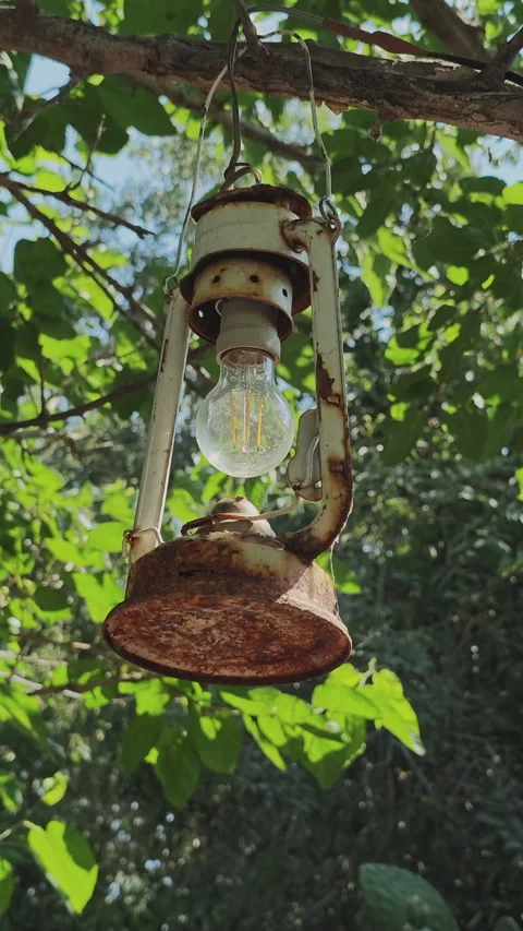 Old rusty white kerosene lamp converted into an electric light fixture 動画素材 342612701
