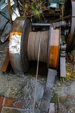 Old rusty winch with metal cable Stock Photos