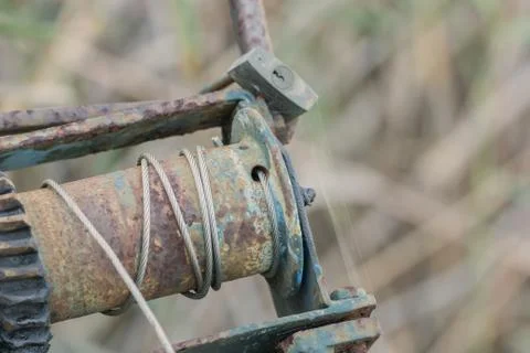 Old, rusty winch with soft bokeh Foto stock