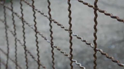 Old rusty wire mesh fence Stock Footage 324510875