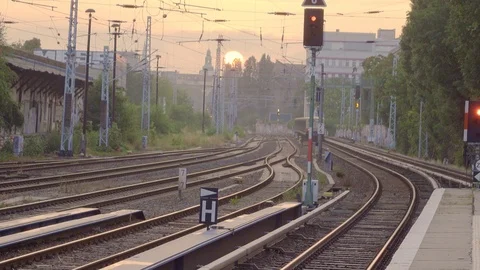 Old S-Bahn subway train arrives at station in Berlin at sunset. 動画素材 126911371