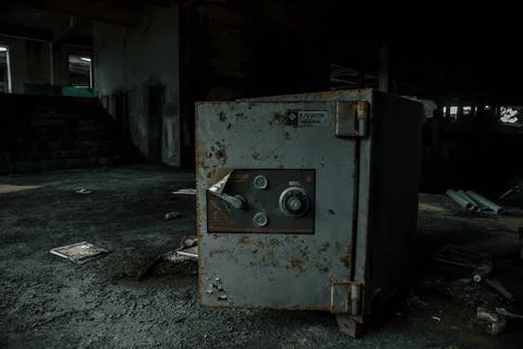 Old safe in an abandoned hotel. Rusty safe. Stock Photos
