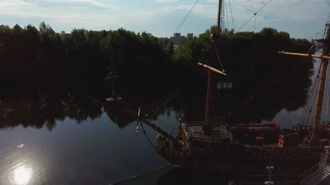 Old sailing ship on the background of multi-storey buildings Video stock 132660501