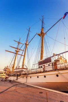 Old sailing ship in the rays of light of the setting sun Stock Photos