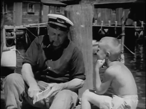 An old sailor telling stories, writer Joseph Crosby Lincoln and Shavings Shop Stock Footage