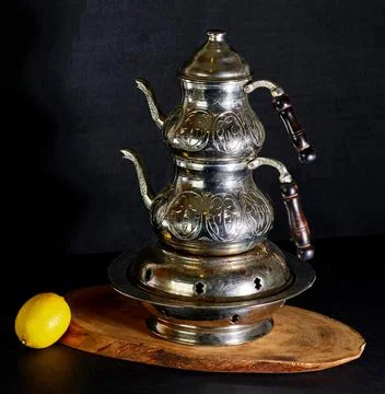 Old Samoar on the table with lemon. Stock Photos