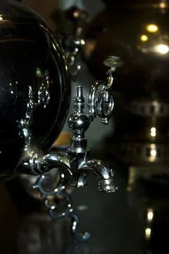 Old samovar on a black background. Shallow depth of field. Stock Photos