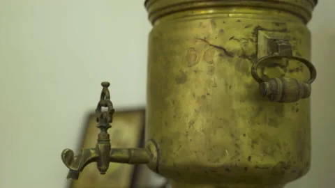 An old samovar designed for heating water and cooking decoctions on the table. Video stock 231753100