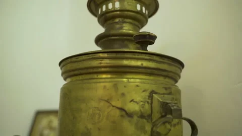 An old samovar designed for heating water and cooking decoctions on the table. Stock Footage 231753850