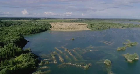 The old sand quarry has turned into a lake with clear water. Stock Footage 136119809