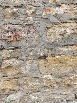 Old sandstone wall background on which the dried mortar can be seen Stock Photos