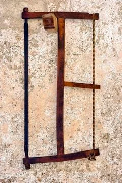 Old saw hangs on a wall Stock Photos