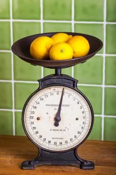 Old scales with lemons Stock Photos