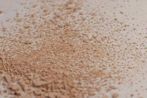 Old scattered broken cosmetics, makeup powder , dust and small and large piec Stock Photos