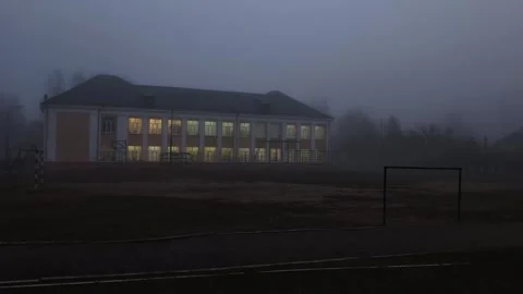 Old school building with lights on in windows against foggy background in autumn Stock-Footage 304960307