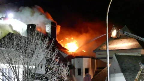 Old school with roof on fire Stock Footage 139657242