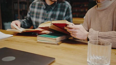 Old school studying. Zoom in shot of unrecognizable man and woman students Stock Footage 169707233