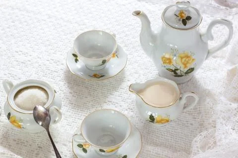 Old school style tea at five afternoon service set sweet traditional table ho Stock Photos
