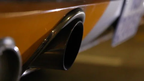 Old school yellow Mustang starting the motor exhaust. Stock Footage